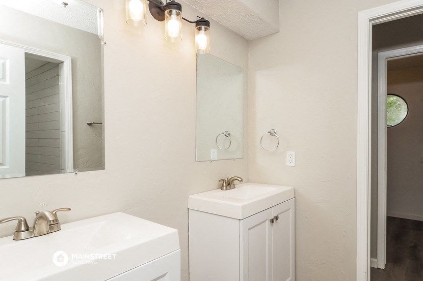 a bathroom with a sink and a mirror