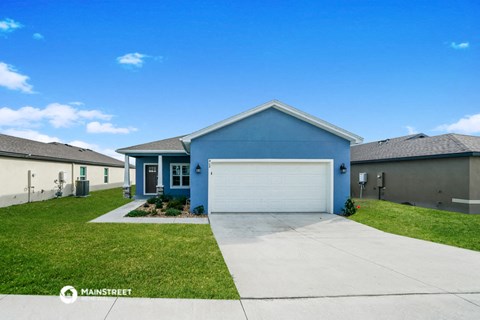 a blue house with a white garage door