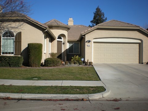 a house with a driveway and a garage door