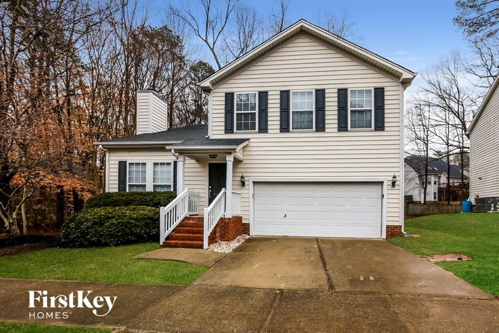 A two-story house with a garage is for sale by FirstKey Homes.