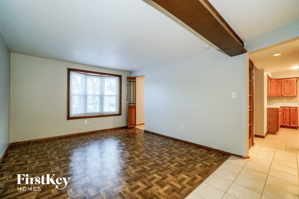 the living room is open to the dining room and kitchen