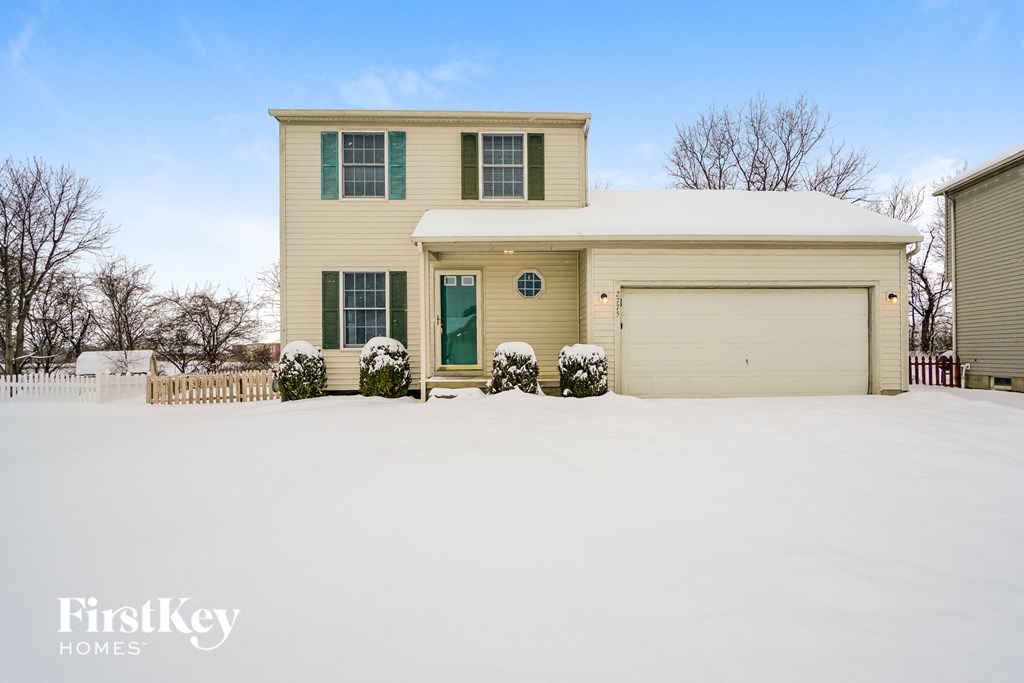 a house covered in snow in the snow
