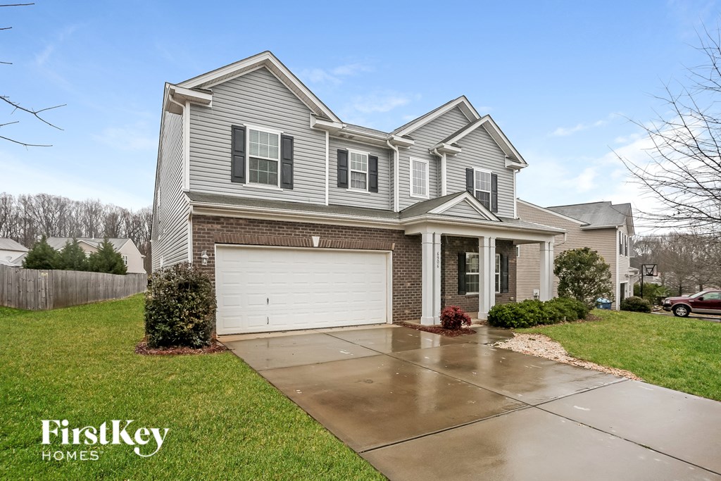 A house with a garage is for sale by FirstKey Homes.