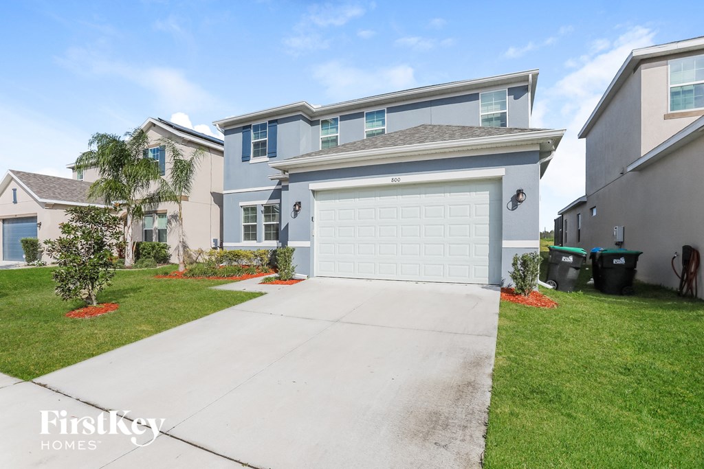 A house with a garage is for sale.
