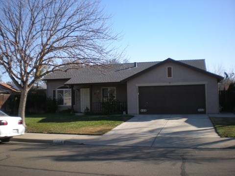 a house with a driveway and a garage door