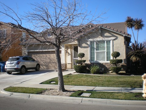 a house with a car parked in front of it
