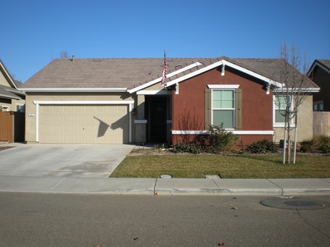 a house with a driveway and a garage door