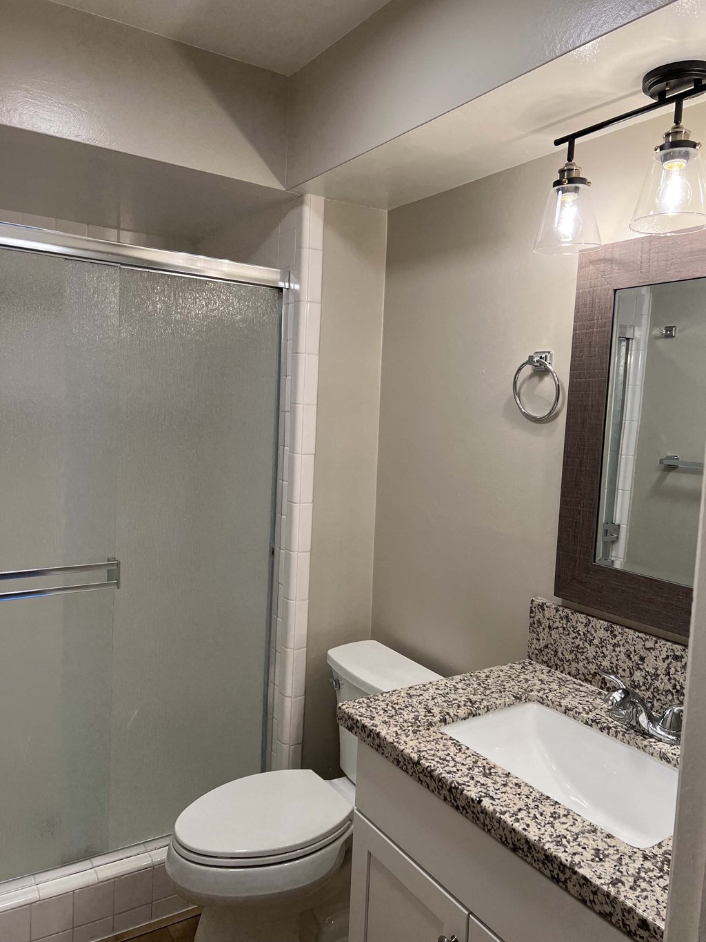 a bathroom with a sink toilet and a shower