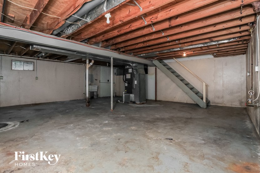 2990 e 112th street 312 a furnished basement with a staircase