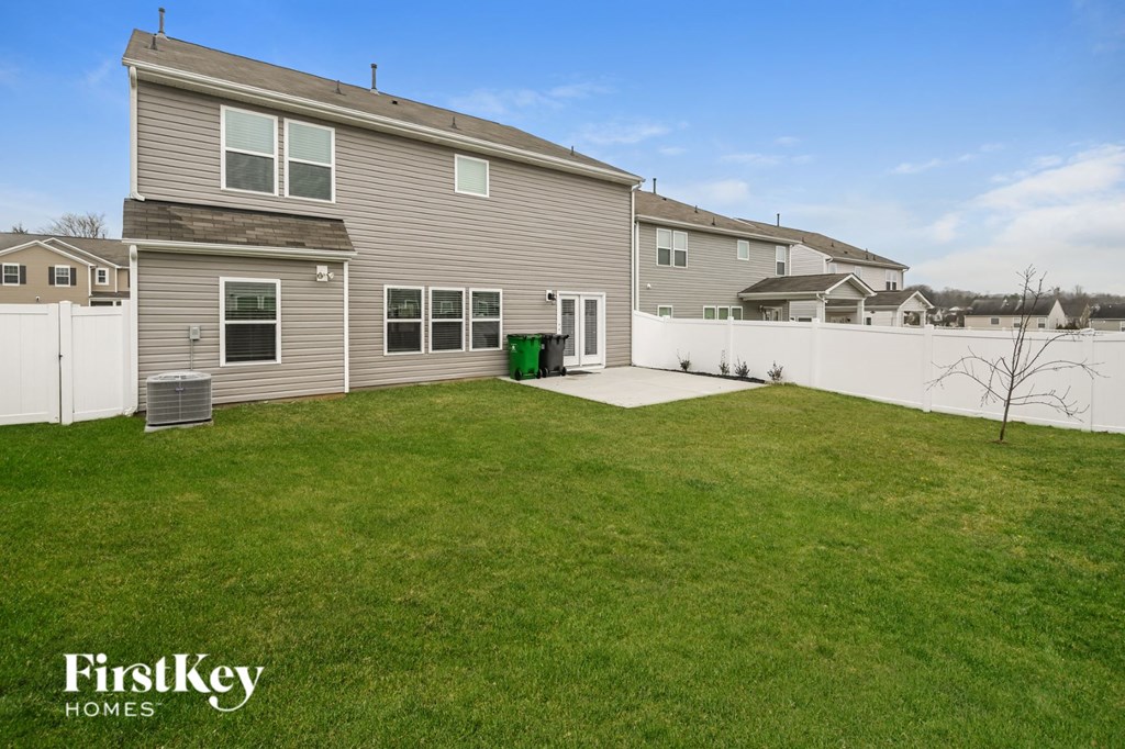 A house with a lawn in front of it is for sale.