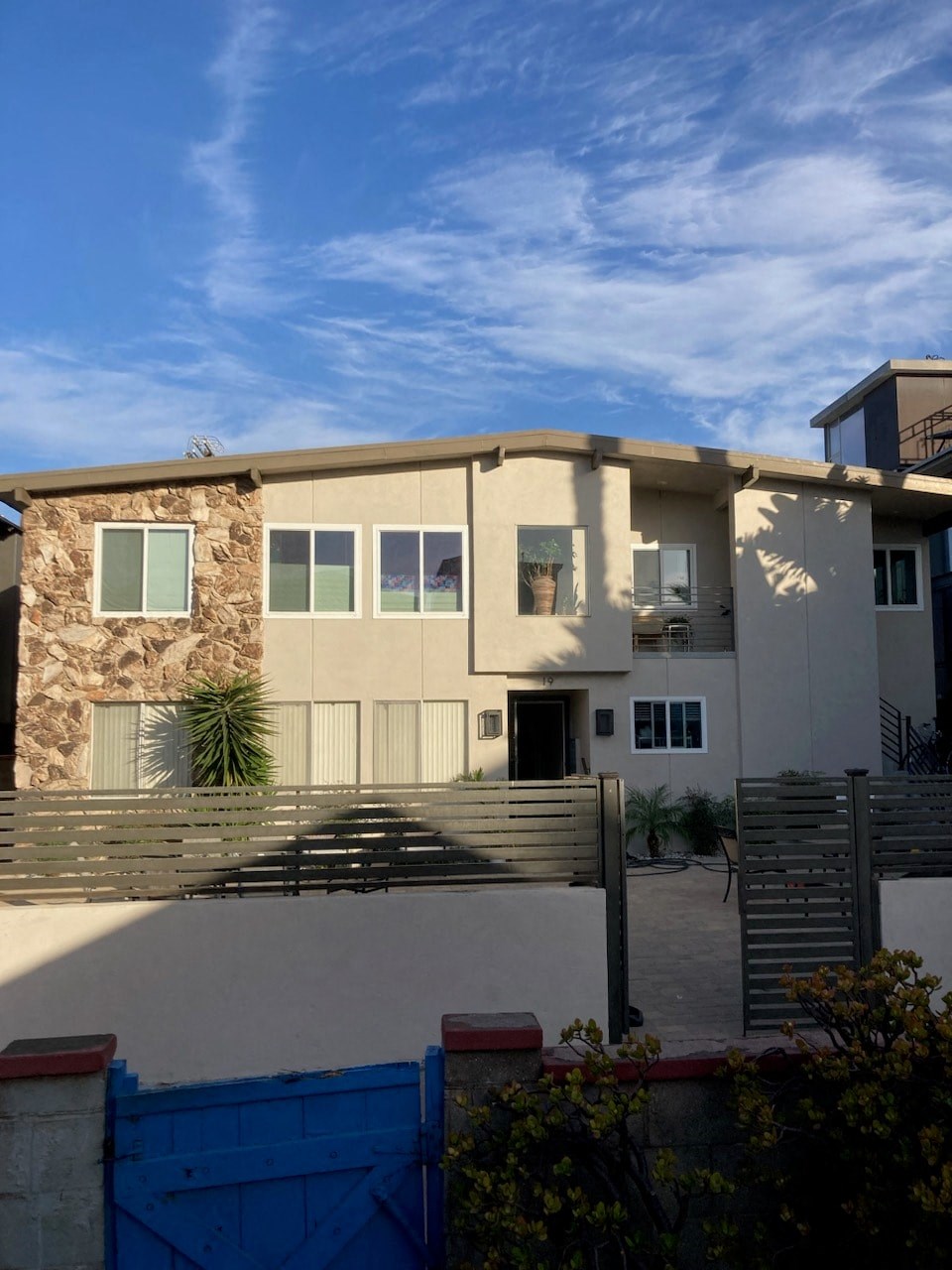 the front of a building with a clear blue sky