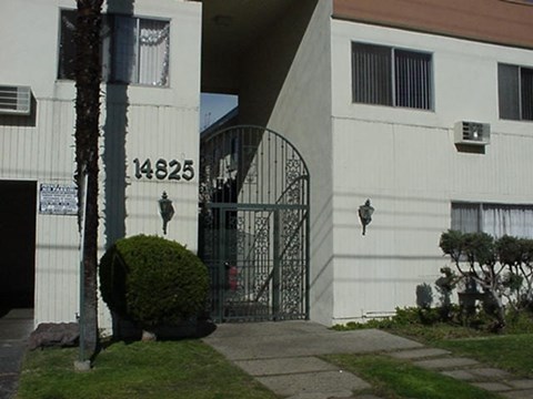 a wrought iron gate in front of a building