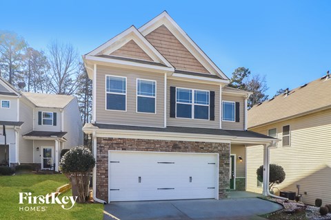 a house with a white garage door in front of it