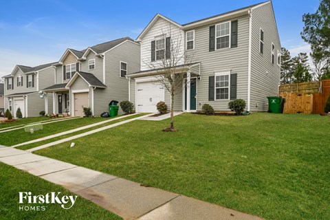A row of houses with a FirstKey Homes logo.