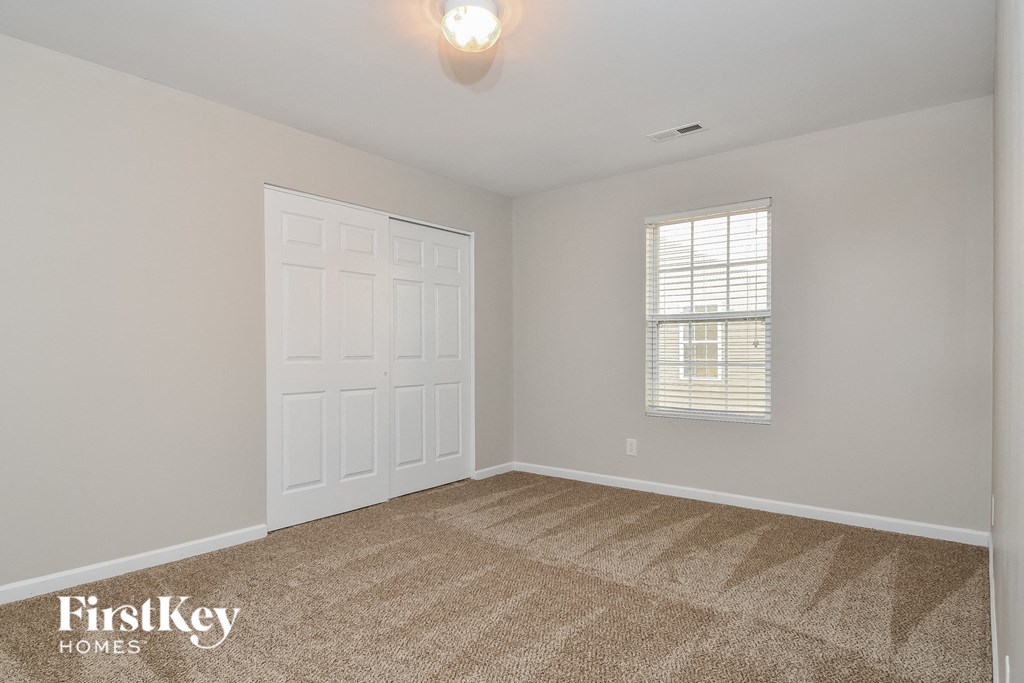 the second bedroom is spacious and ready for you to use