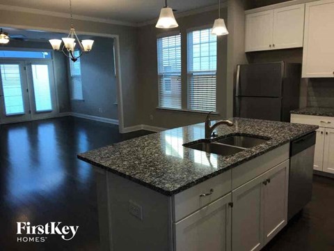 a kitchen with a granite counter top and a sink