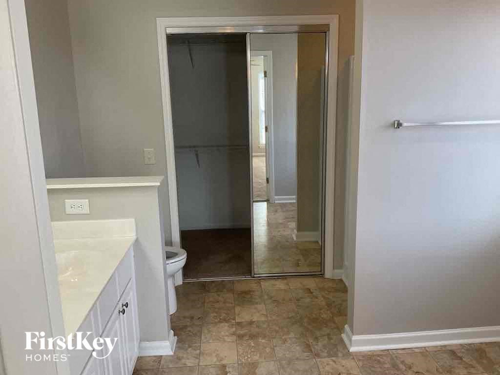 a small bathroom with a sink and a toilet in a room