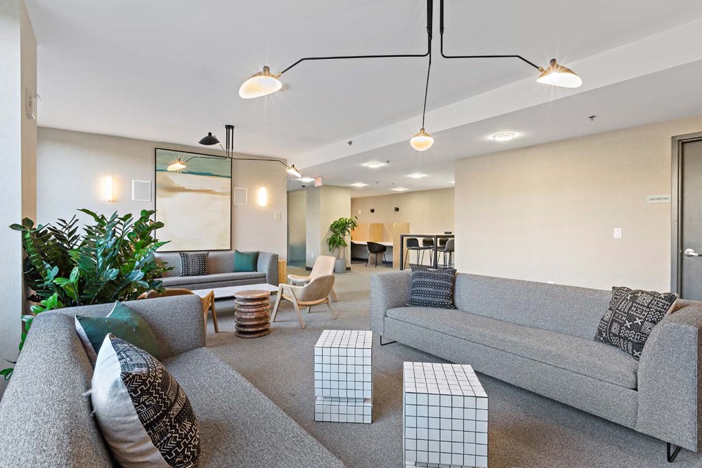 a large living room with couches and tables