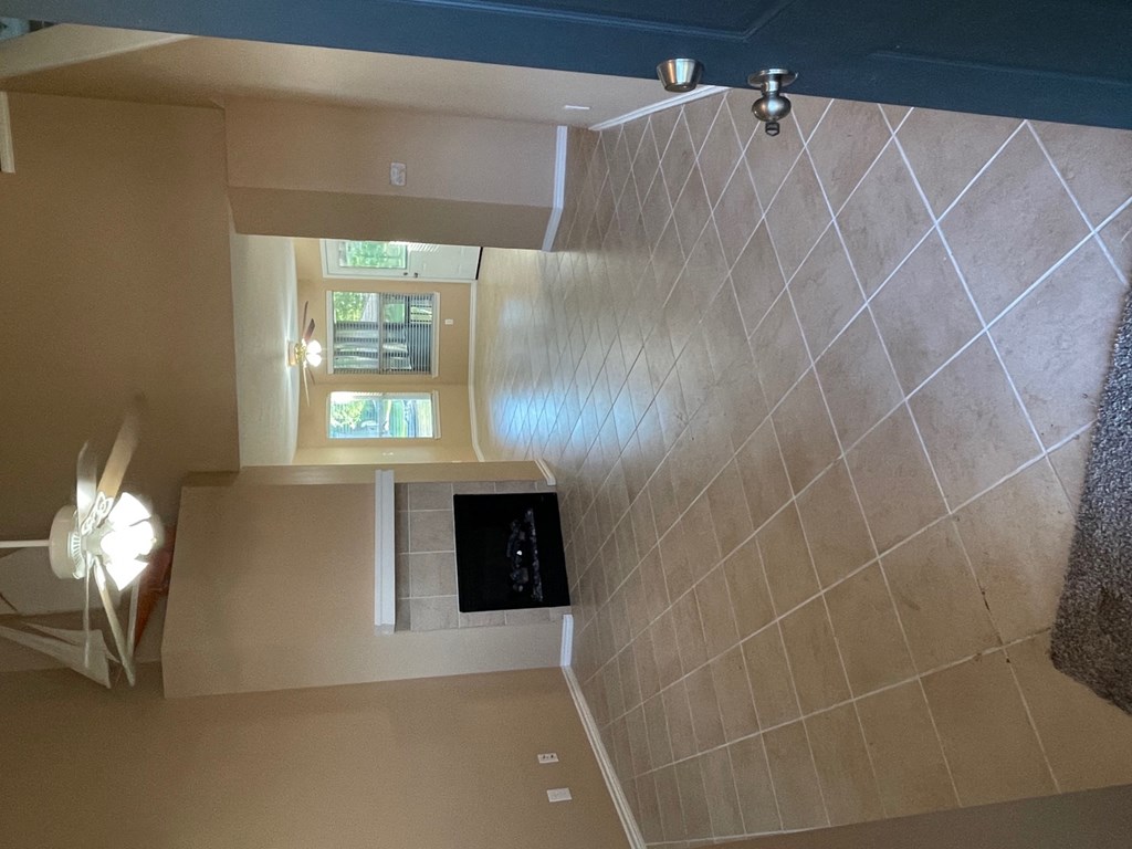a view of a bathroom with a shower and a window