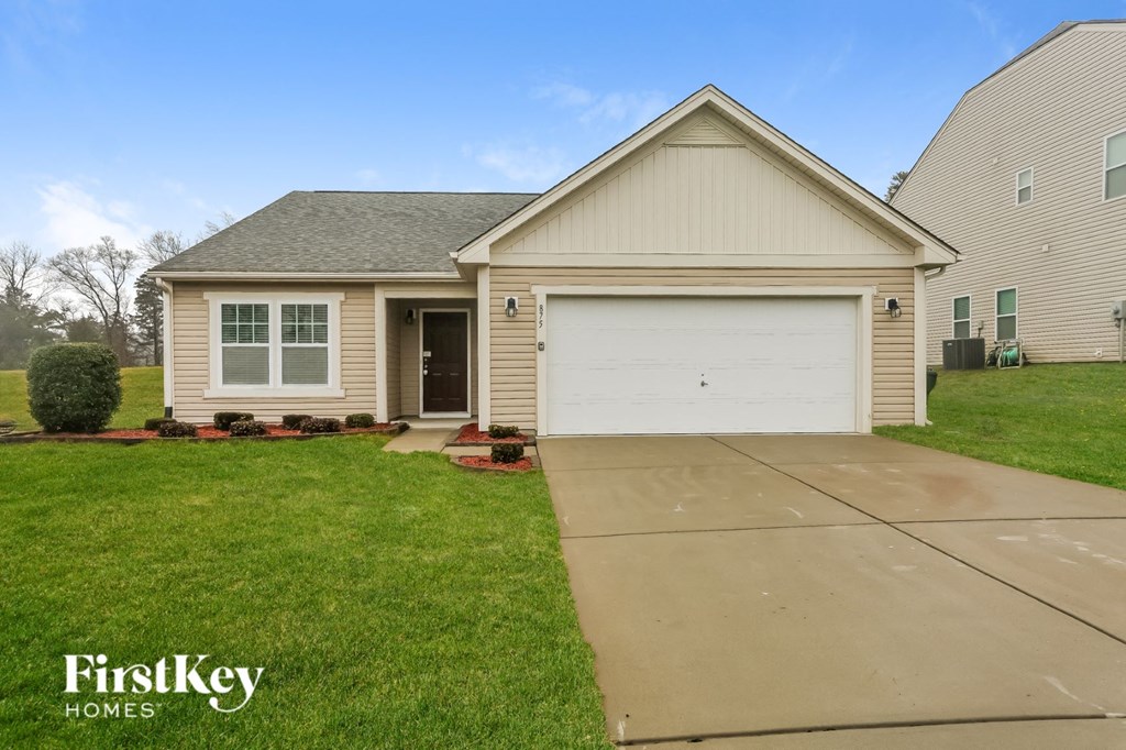 A house with a garage is for sale by FirstKey Homes.