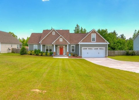 a large lawn in front of a house