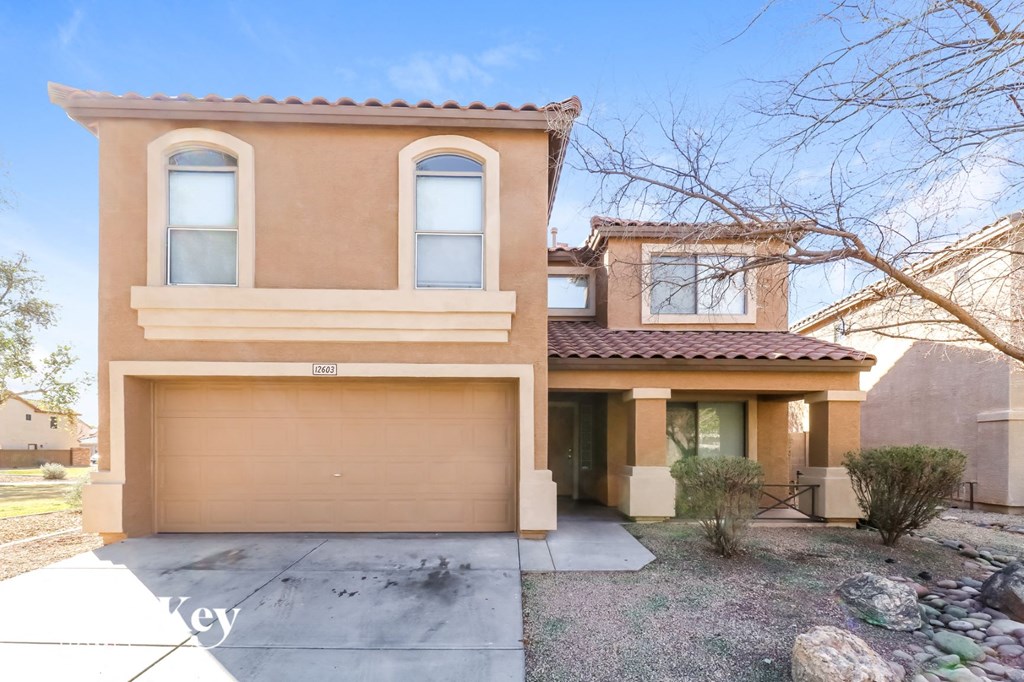the front of a house with a garage door