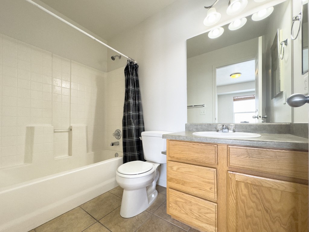 an image of a bathroom with a toilet and a sink