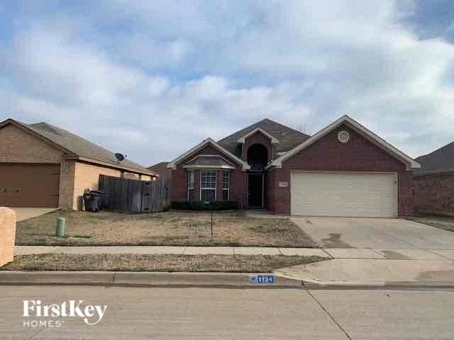 a house with a driveway and a garage door