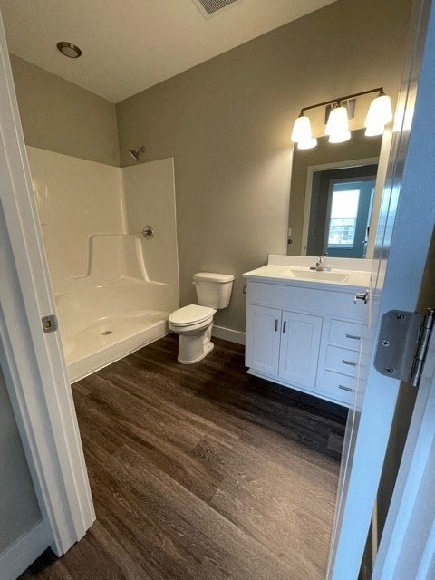 a bathroom with a toilet and a sink and a bath tub