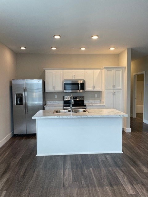 a kitchen with a counter top and a refrigerator