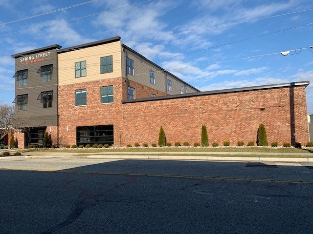 a brick building on the side of a street