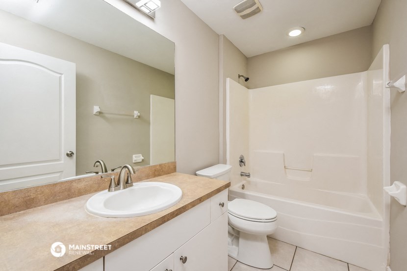 a bathroom with a sink toilet and a shower
