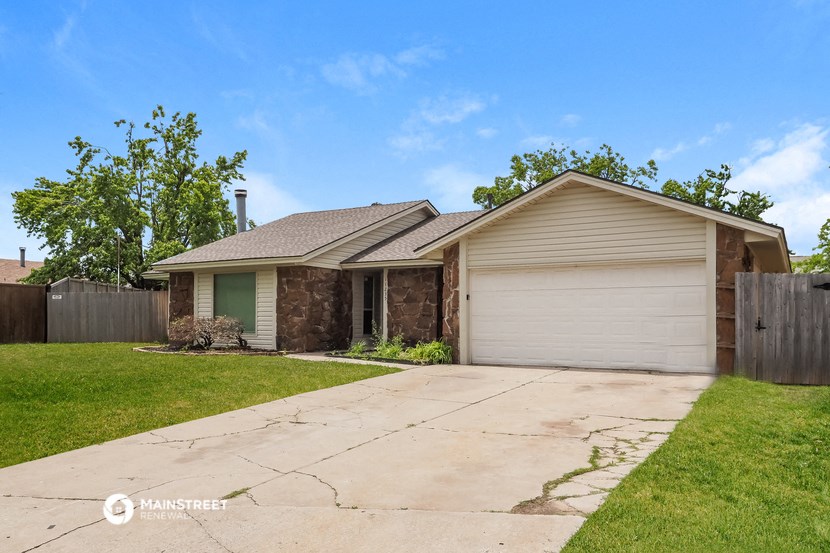 a house with a driveway and a garage door