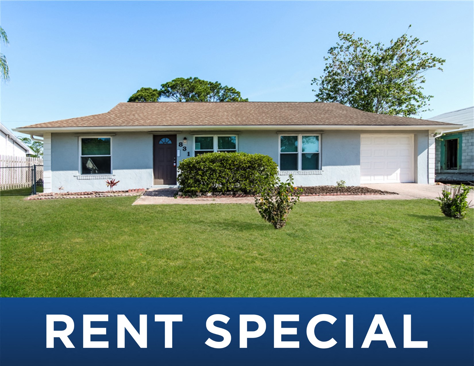 a house with the rent special sign in front of it