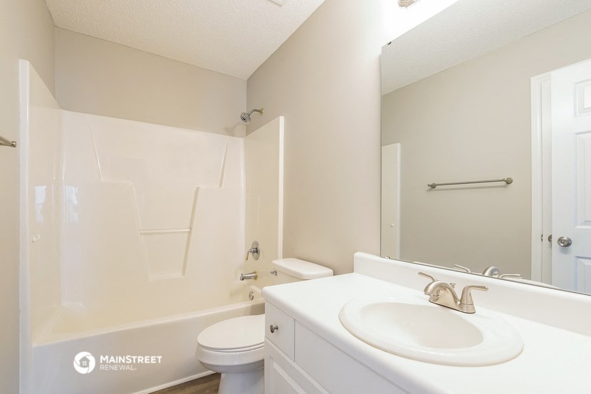 the preserve at ballantyne commons apartment bathroom with sink toilet and shower