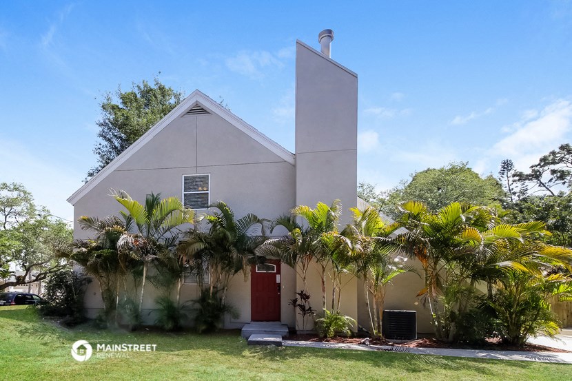 a church with palm trees in front of it