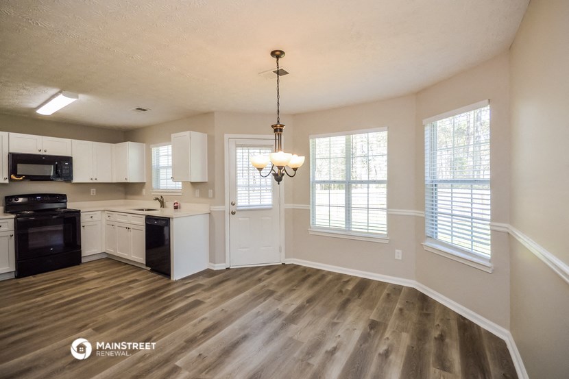 the kitchen and living room of an open floor plan
