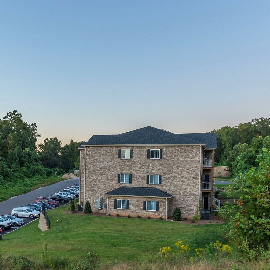 a view of a house and a parking lot
