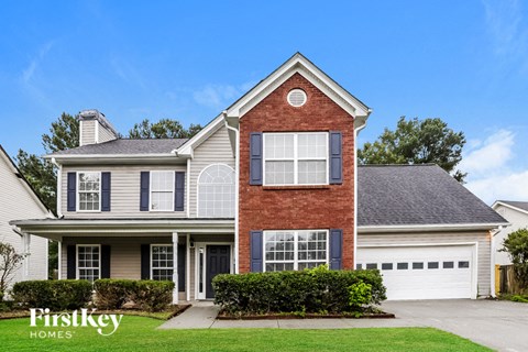 a house with a garage and a lawn