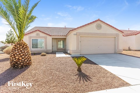a house with a palm tree in front of it