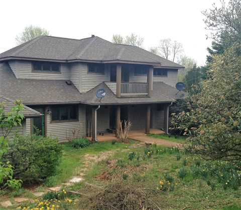 a view of a house from the back yard