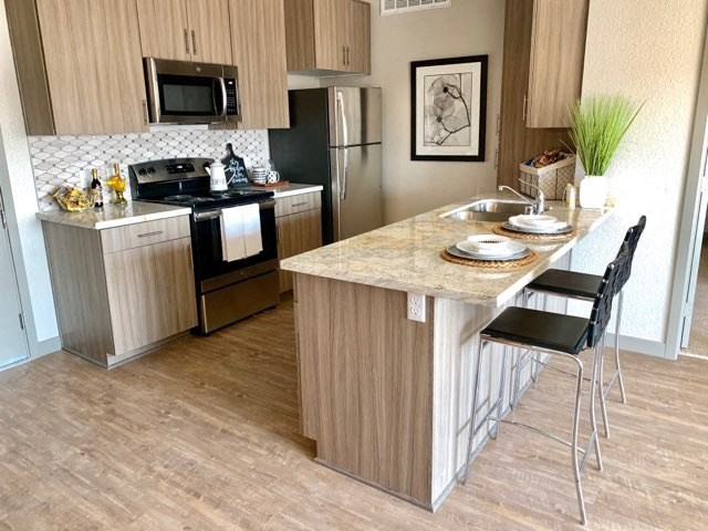 a kitchen with a counter top and a sink