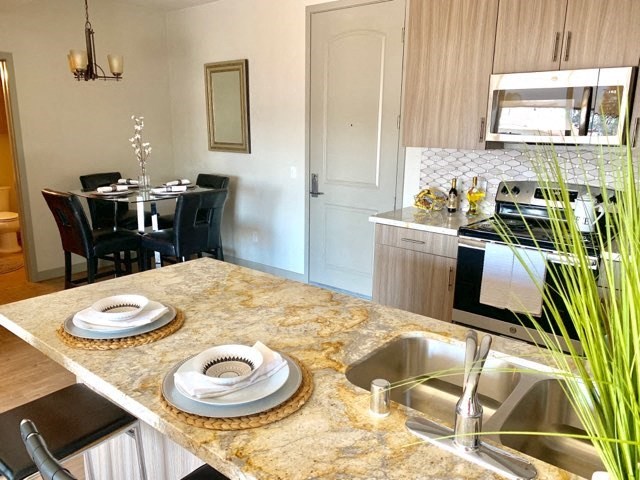 a kitchen with a sink and a counter top
