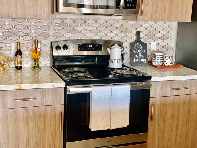 a kitchen with a stove and a microwave