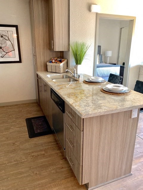 a kitchen with a counter top and a sink