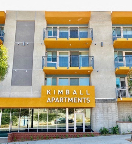 an apartment building with a sign for kimball apartments