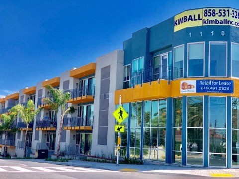a building with a street sign in front of it