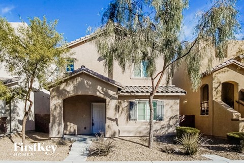 a house with a tree in front of it
