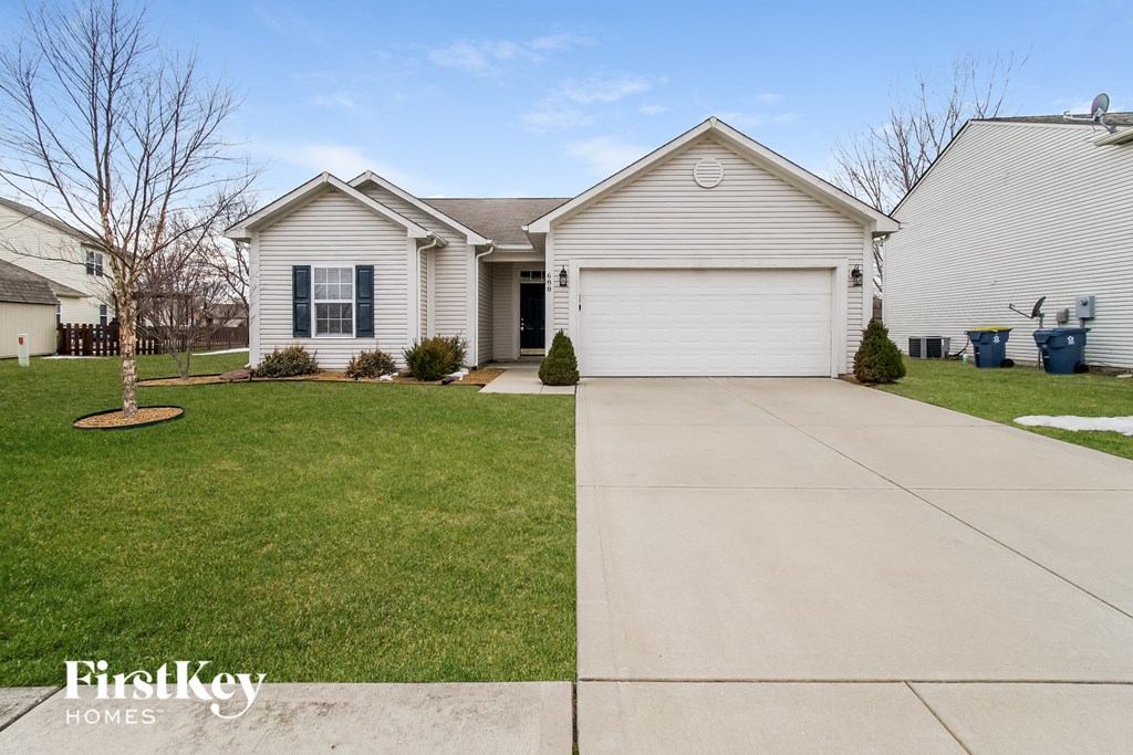 A house with a garage is for sale by FirstKey Homes.