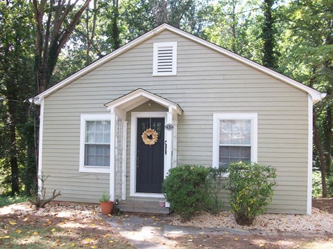 the front of our house with a wreath on the door